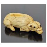 Antique ivory Netsuke, recumbent ox, signed