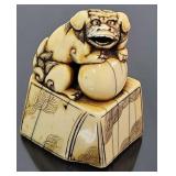 Antique Ivory Netsuke, foo dog on pedestal, signed