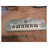 Casio SA-75 Small Keyboard & Music Stand