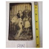 WWII Military Man Sitting on Stuffed Lion Photo
