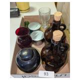 (2) Brown Glass Jugs w/ Stoppers, Candles & Other