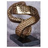 GOLD ACCENTED ABSTRACT COIL SCULPTURE ON STONE