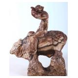 SEDIMENTARY STONE CARVED COWBOY ON BULL STATUE