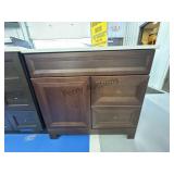 36 x 19 brown bathroom vanity with white granite