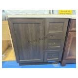 30 x 19 dark brown vanity with white granite top.