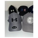 An Assortment of Five Under Armour Performance Bas