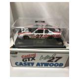 Two Diecast race cars in org packaging