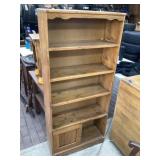 Pine  bookshelf approximately 10 x 28 x 62 tall