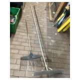 Approximately 8 foot shovel with rakes