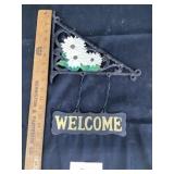 Cast-iron welcome sign