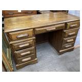 Oak kneehole desk approximately 51 x 23 x 31 tall