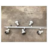 Track lighting approximately 4 feet long each
