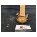 Amber hen on the nest