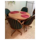 Table and 4 rolling chairs