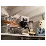 Coffee pots, kitchenware / in a low closet/ you