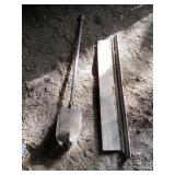 Primitive post hole digger and wood trim
