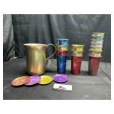 Vintage colored aluminum cups and pitcher