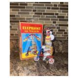 Tin litho elephant on tricycle