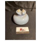 Blue glass insulator