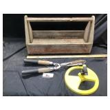 Carpenters tote with hedge, clippers, and