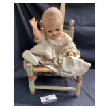 Doll in chair