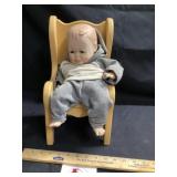 Porcelain doll in chair
