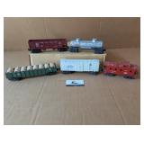 5 Lionel O gauge cars/caboose (Refrigerated Milk