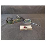 Vintage cateye glasses and magnifying glass