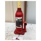 Big red hydraulic jack works as a shit