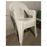 Stack of Plastic lawn chairs
