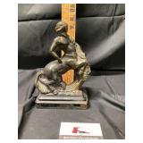 Vintage metal doorstop depicting a Centaur with a