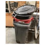Four garbage cans and two lids