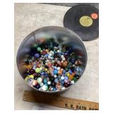 Tin of marbles