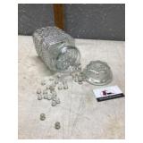 Canister of marbles