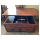 Rise top coffee table with storage