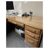 Large wooden office desk with a glass top