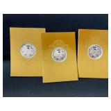 Box of three Franklin mint metals on Christmas