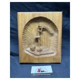 Hand carved well pump art