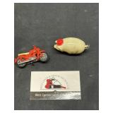 Plastic pig and little motorcycle