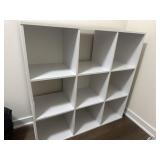 White cubby shelf- has a bad side