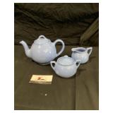 Liptonï¿½s teapot with cream and sugar dishes