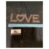 Cast-iron love sign