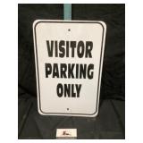 Metal visitor parking only sign