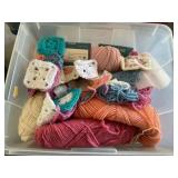 Small tote of yarn and crocheted items
