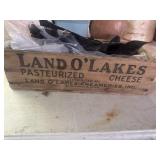 Garbage bags and Land o lakes cheese box