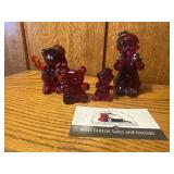 Red glass clowns and teddy bear