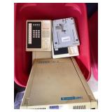 Tote of phone parts and phone items