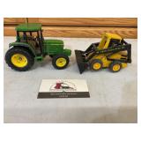 John Deere tractor and New Holland skid loader
