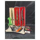 Assorted knives and flashlights and advertising