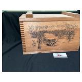 Wooden storage box with cabin scene